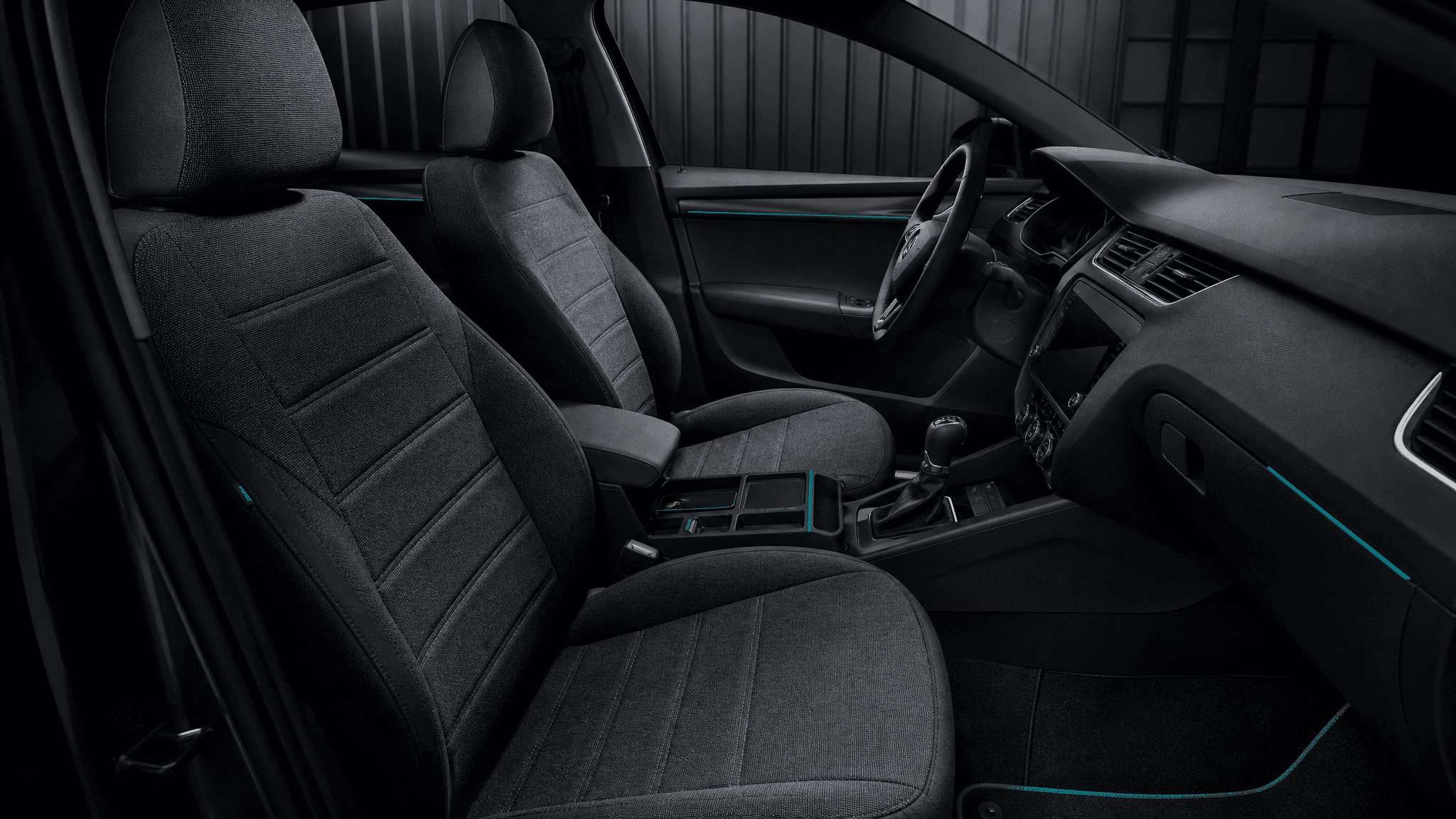 A refreshed car cabin fitted with charcoal seat covers, floor mats and console storage
